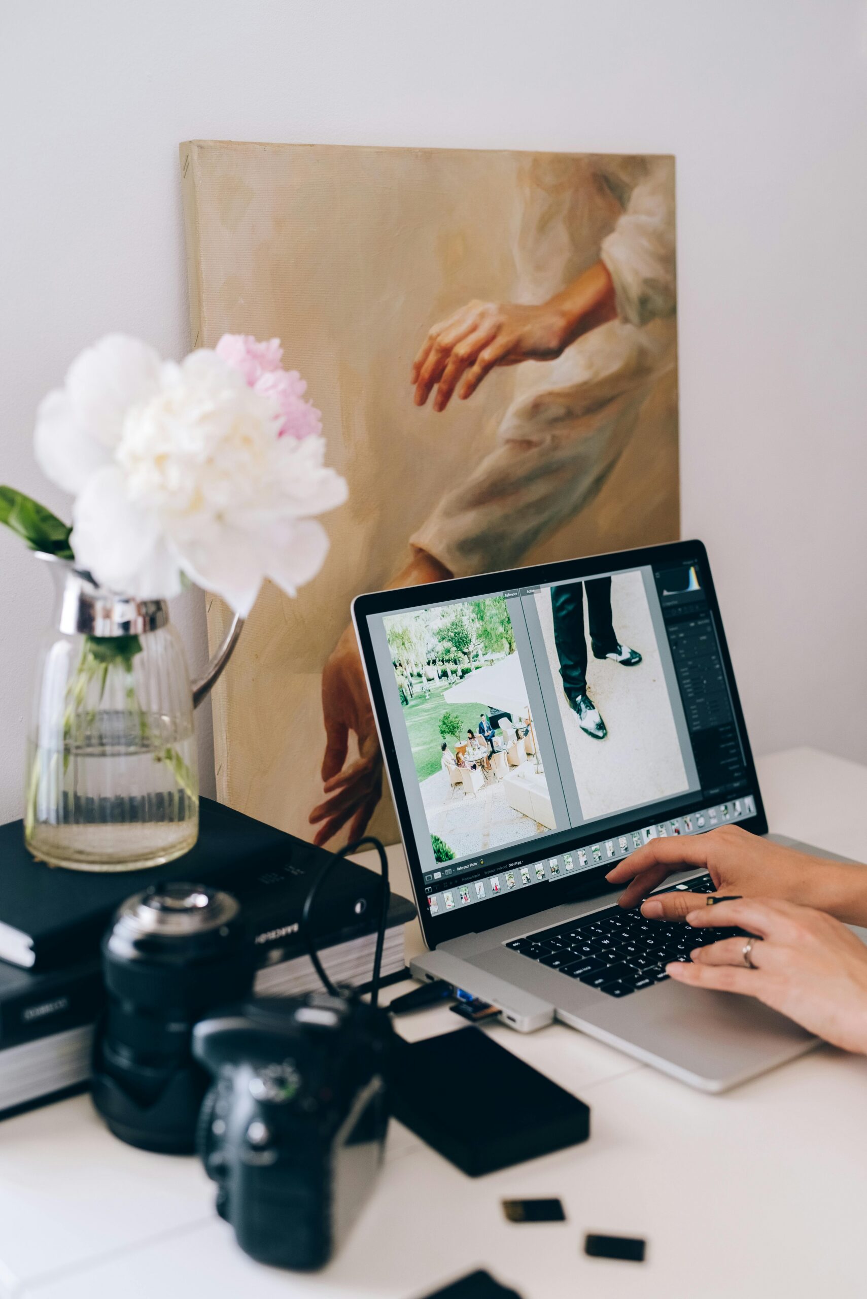 Photographer working on a computer editing photos.