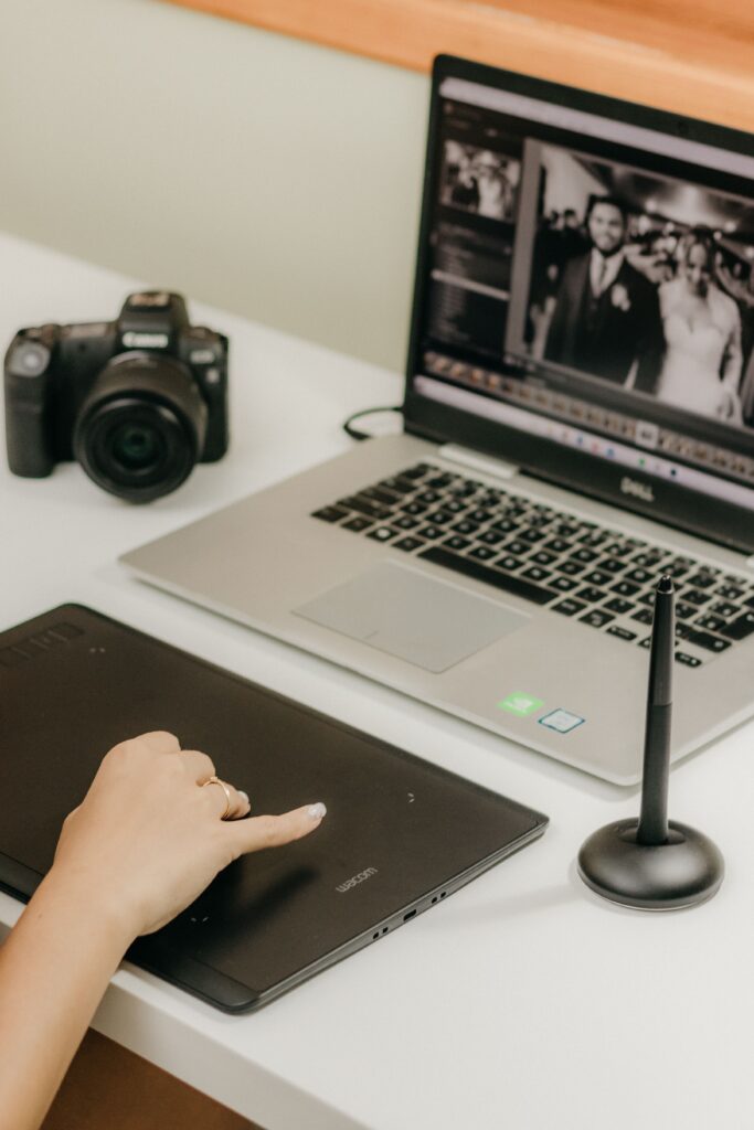 Photographer working at computer editing images.