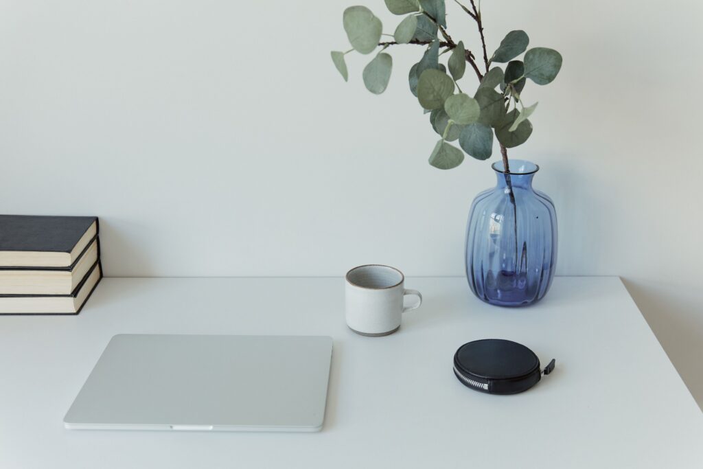 A photo of a computer at a desk for a photographer wondering if they should update their website.